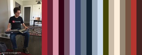 Jonny next to vertical stripes of color